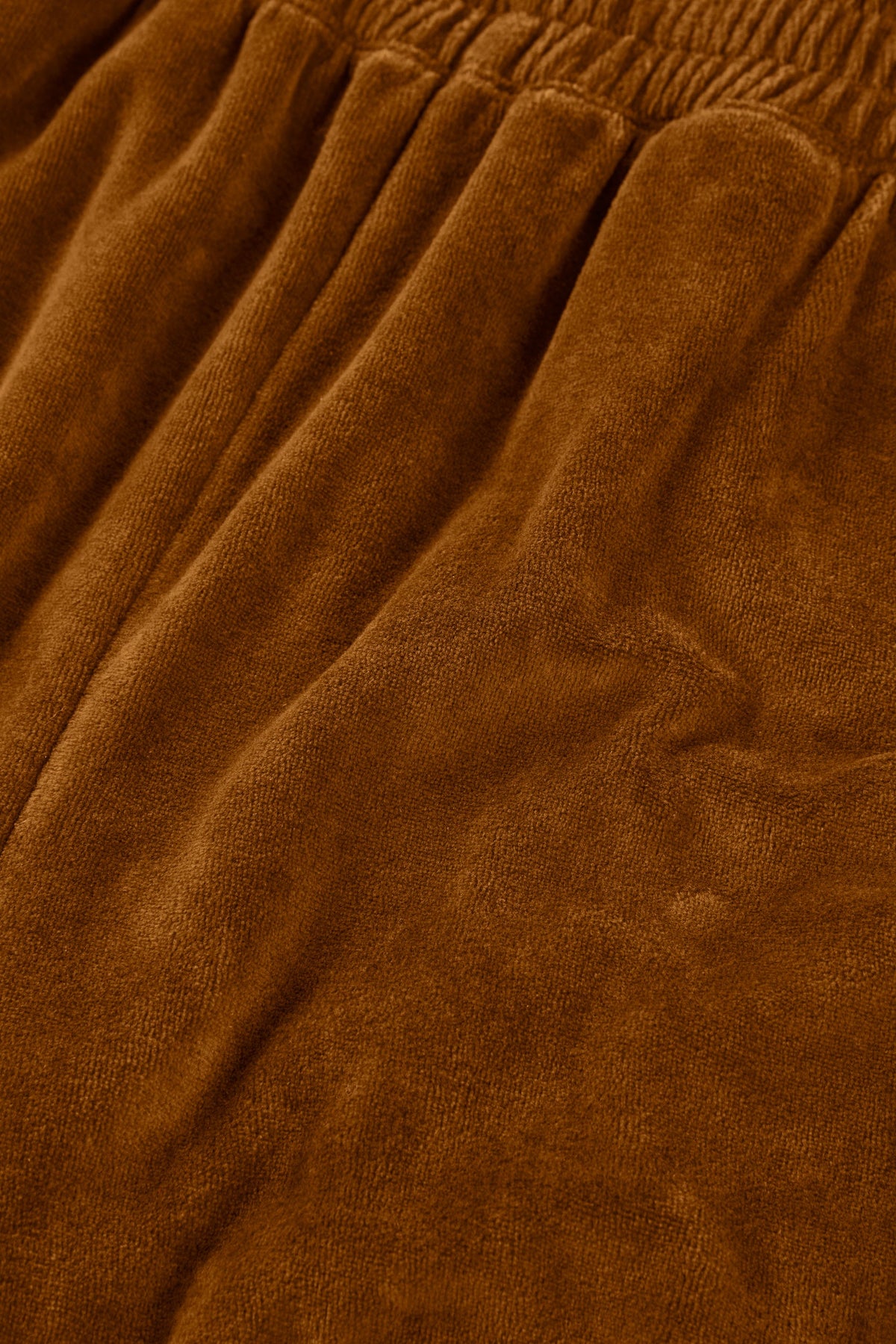 Organic cotton velvet joggers in terracotta