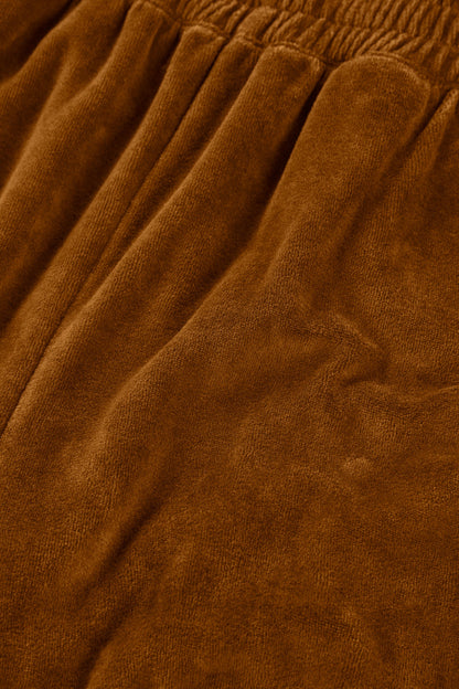 Organic cotton velvet joggers in terracotta