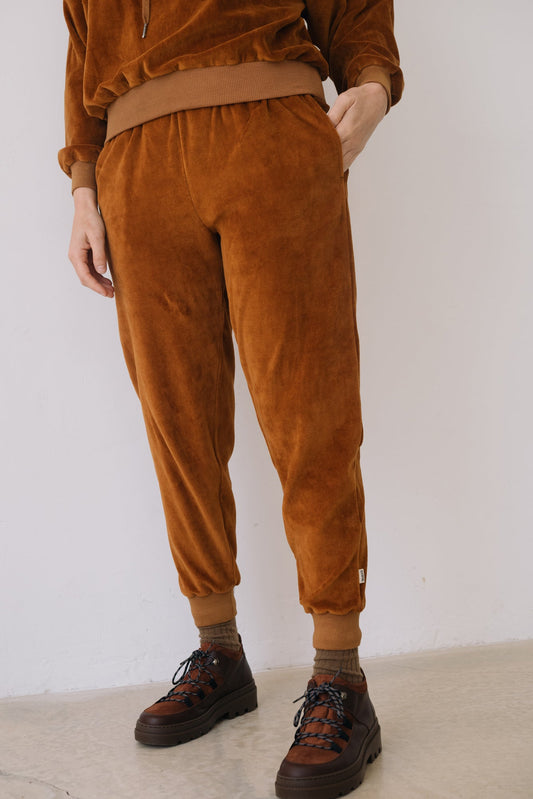 Organic cotton velvet joggers in terracotta